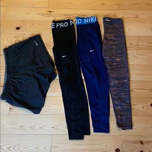 3 pairs of Nike leggings and 1 pair of Nike shorts